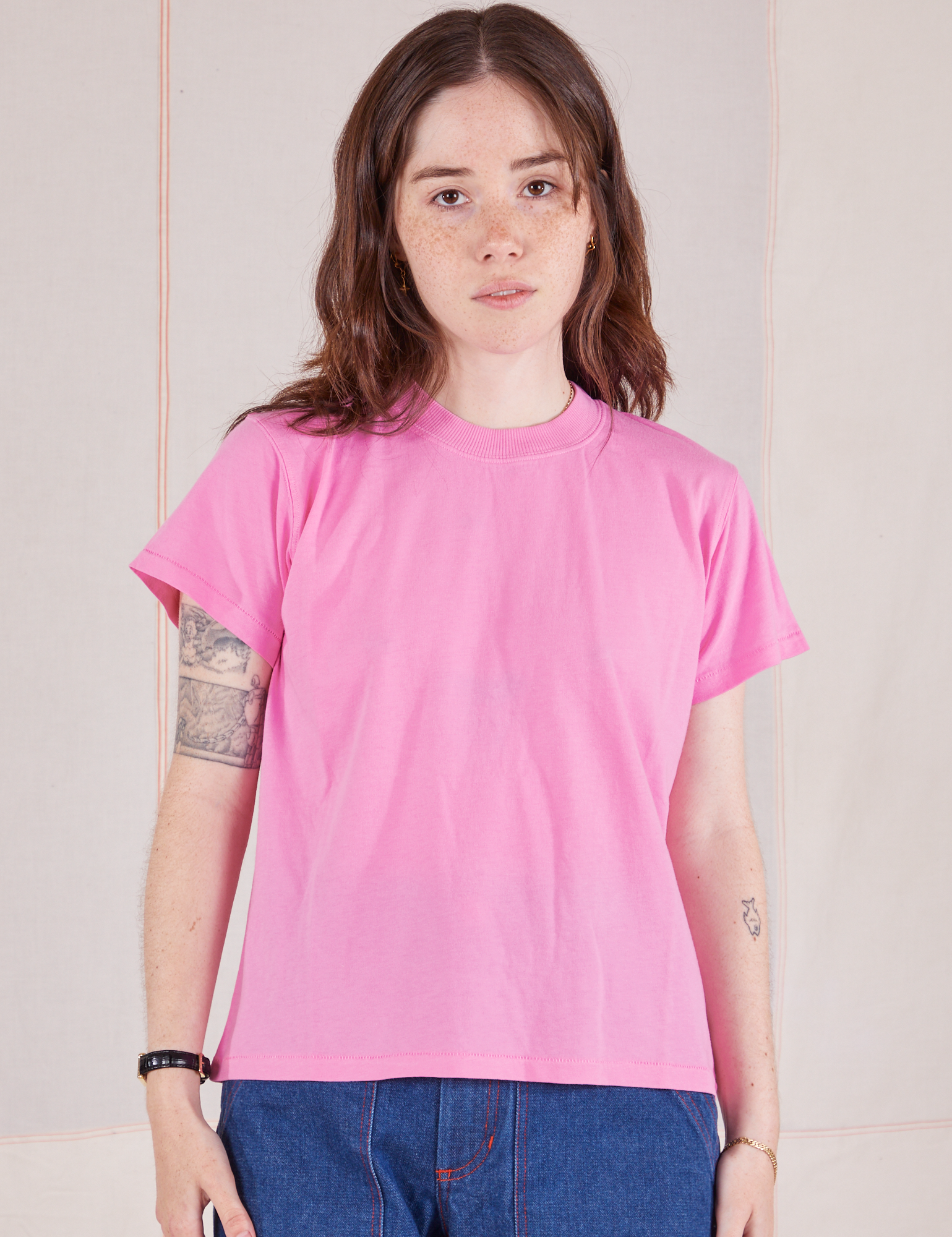 Hana is 5'3" and wearing P Organic Vintage Tee in Bubblegum Pink