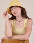 Alex is wearing the butter yellow Wide Brim Denim Bucket Hat