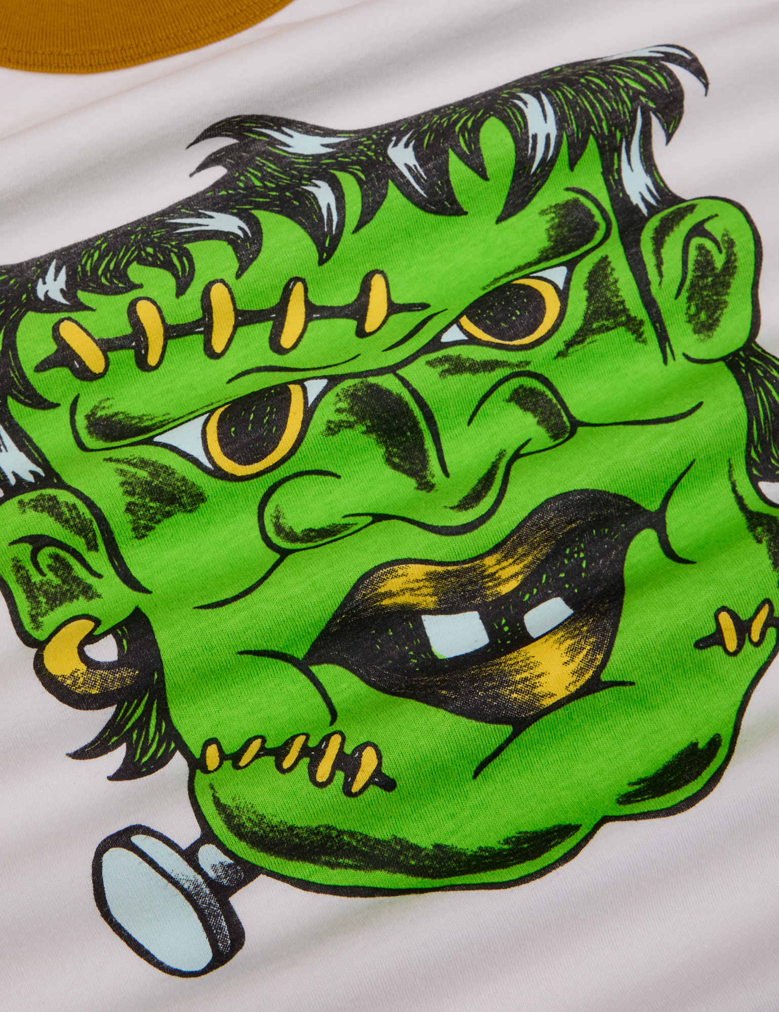 Close up of screenprinted green Frankenstein
