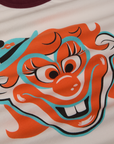 Close up of clown face in orange, blue and black