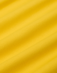 Baby Tee in Golden Yellow fabric detail close up