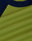 Fabric close up of the Gross Green/Navy Colorblock Raglan Tee