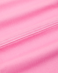 Carpenter Jeans in Bubblegum Pink fabric detail close up with contrast white top stitching.