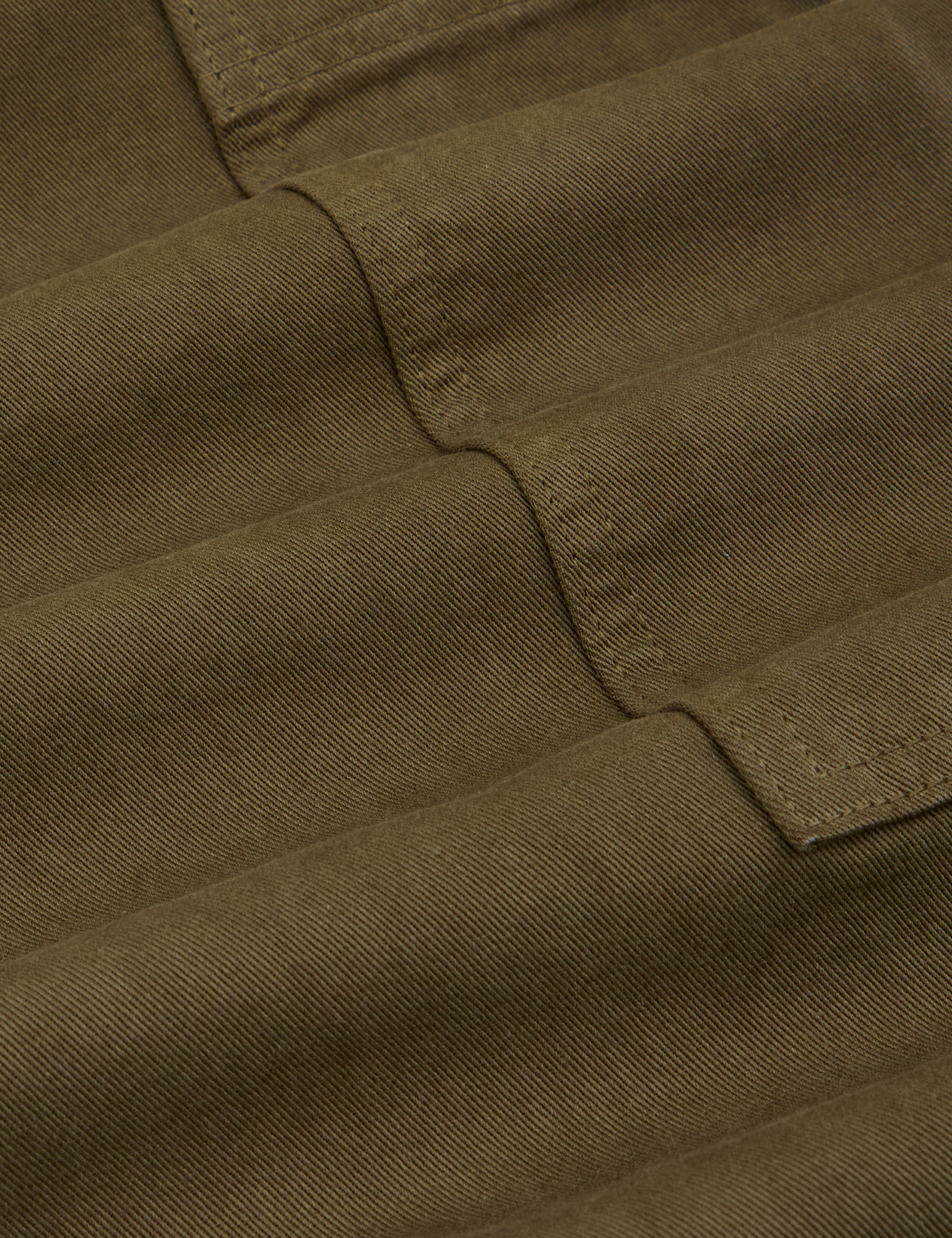 Drop Pocket Cargo Pants in Surplus Green fabric detail close up