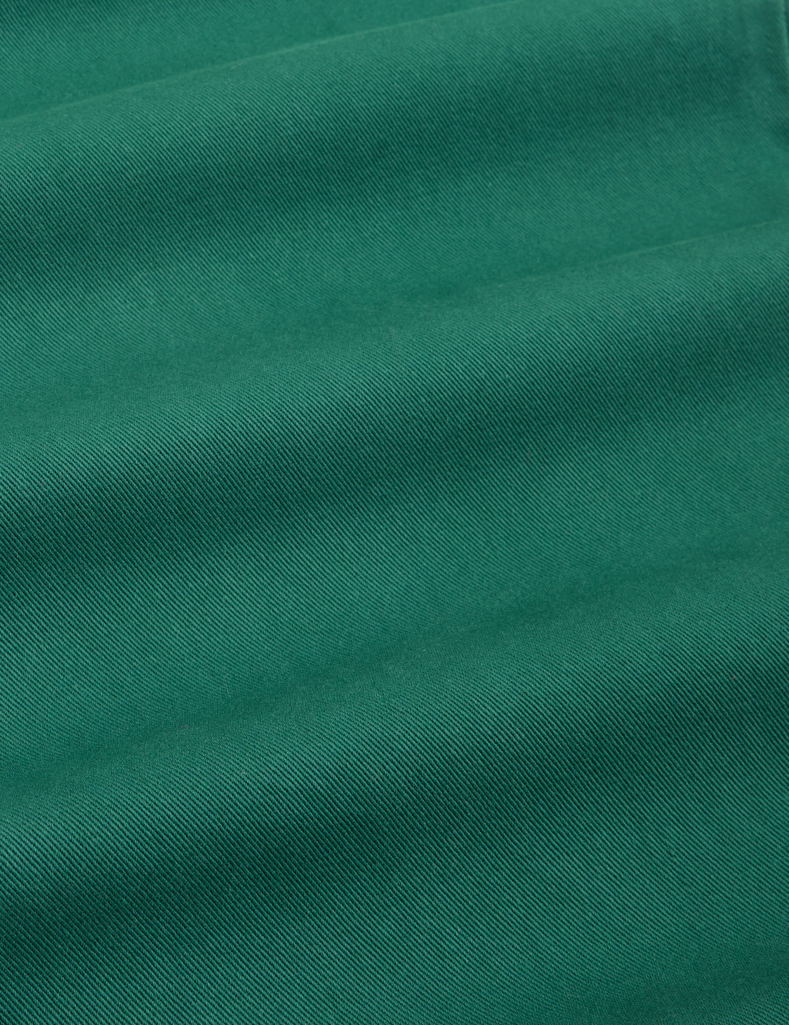 Petite Short Sleeve Jumpsuit in Hunter Green fabric detail close up
