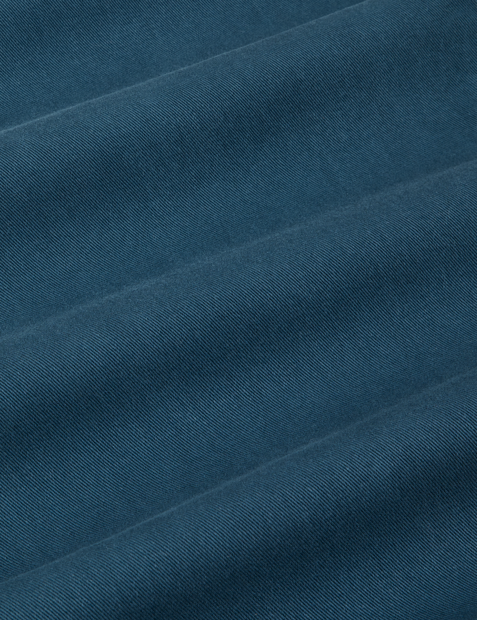 Short Sleeve Jumpsuit in Lagoon fabric detail close up