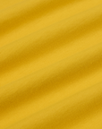 Mismatched Tee in Yellow & Red fabric detail close up