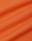 Racerback Tank in Sunset Orange fabric detail close up