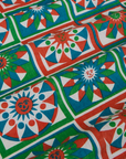 Quilt Print Pantry Button-Up fabric close up of print in green, red, white and blue