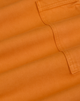 Drop Pocket Cargo Pants in Creamsicle Orange fabric detail close up