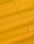 Drop Pocket Cargo Pants in Sunshine Yellow fabric detail close up