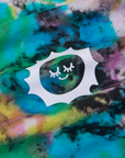 Classic Tee in Rainbow Magic Waters fabric detail close up. Sun Baby logo stamped in white