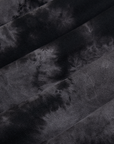 Magic Waters Long Sleeve Burly Tee in Black fabric detail. Tie dyed in black and grey