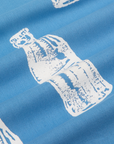 Soda Bottle Pantry Button-Up in Greek Blue close up of white paintstamped bottle