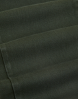 Short Sleeve Jumpsuit in Swamp Green fabric detail close up