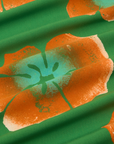 Paintstamped Pantry Button-Up in Kelly Green fabric detail close up. Orange and blue paintstamped flowers.
