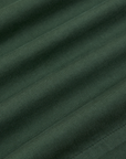 Trouser Shorts in Swamp Green fabric detail close up
