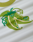 Produce Raglan Tee in Snap Peas close up. Illustrated pair of snap peas in green.
