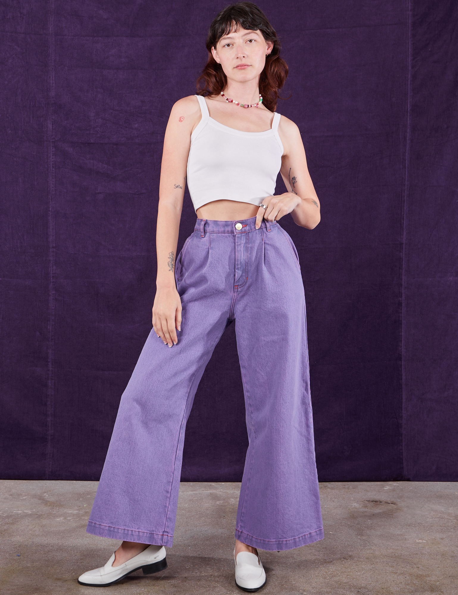 Alex is 5&#39;8&quot; and wearing XXS Overdyed Wide Leg Trousers in Faded Grape paired with Cropped Cami in vintage tee off-white
