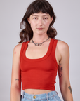 Alex is 5'8" and wearing P Cropped Tank Top in Mustang Red