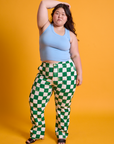 Ashley is wearing Checkerboard Work Pants in White/Green and baby blue Tank Top