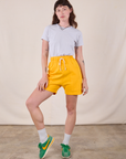 Sweat Shorts in Sunshine Yellow and stone white Jr. Varsity Tee on Alex