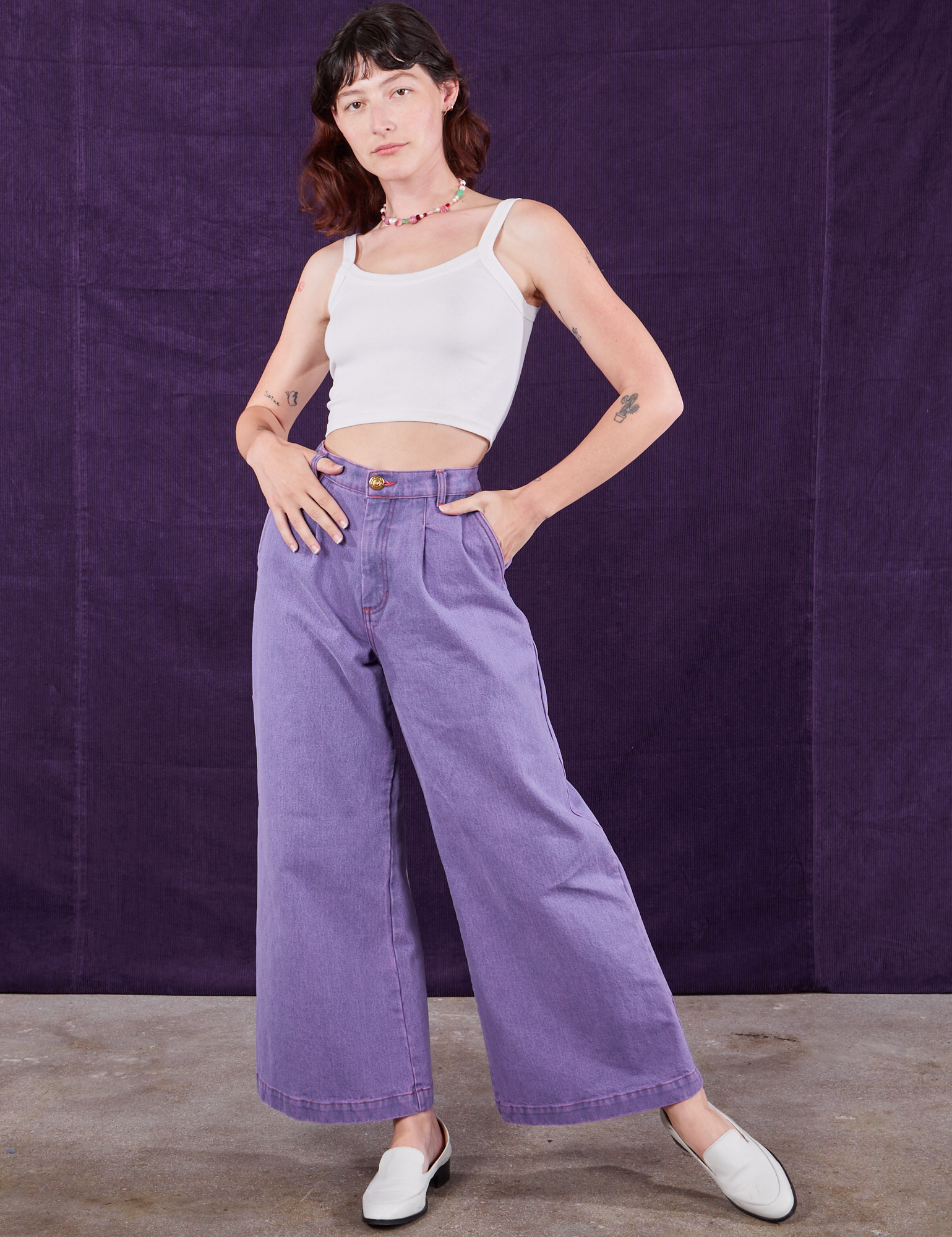 Alex is wearing Overdyed Wide Leg Trousers in Faded Grape and Cropped Cami in vintage tee off-white