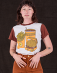 Alex is 5’8” and wearing P Anniversary Tee in Fast Food