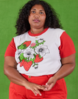 Morgan is 5’5’” and wearing L Anniversary Tee in Strawbaby