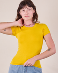 Alex is 5'8 and wearing P Baby Tee in Golden Yellow
