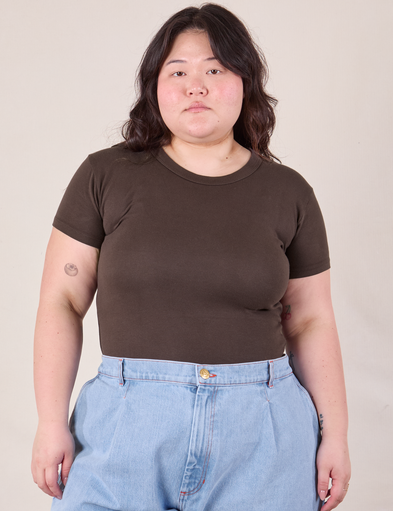 Ashley is 5'7" and wearing L Baby Tee in Espresso Brown