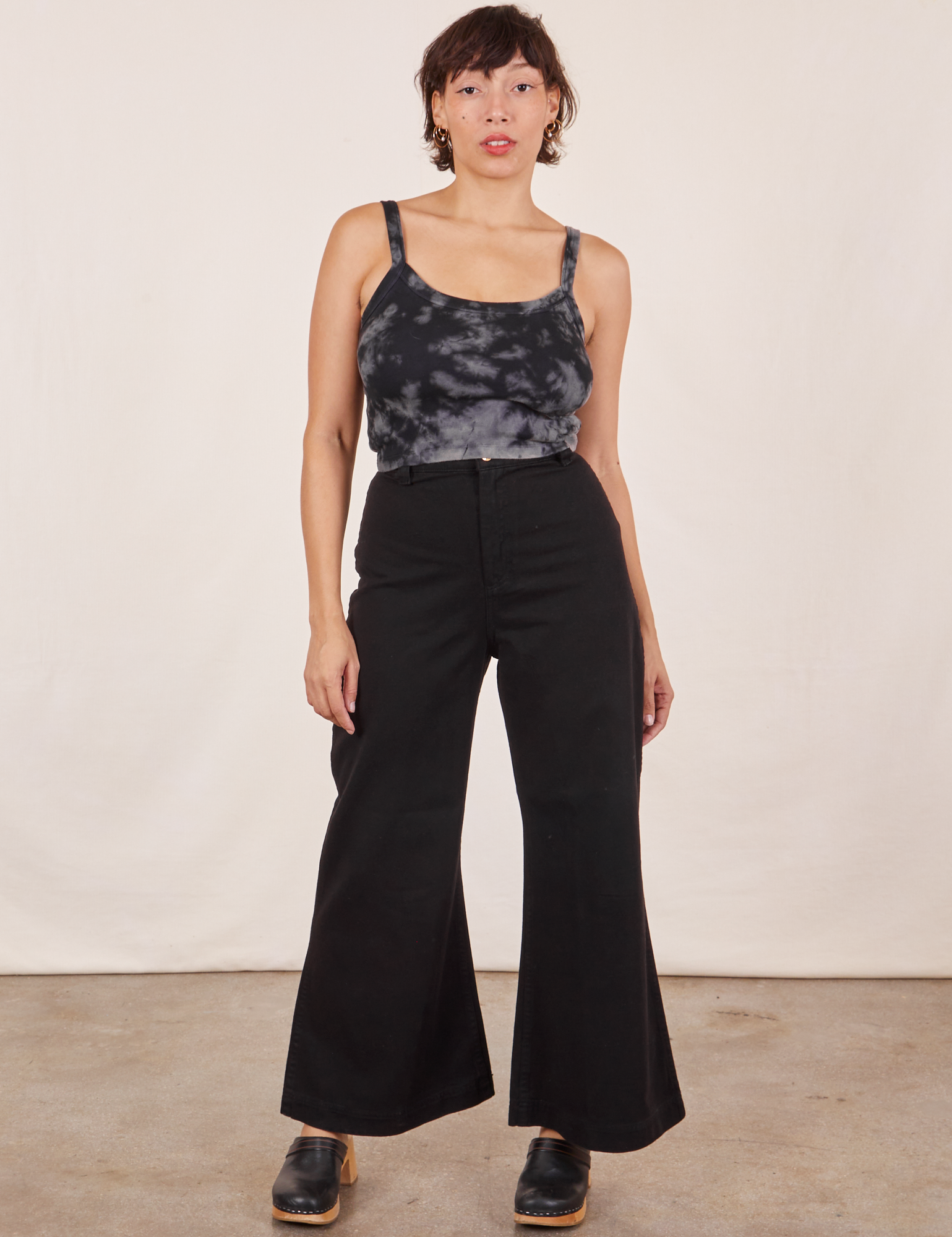 Tiara is wearing Cropped Cami in Black Magic Waters and black Bell Bottoms