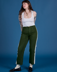 Sydney is wearing Painted Work Pants in Evergreen and vintage tee white Cropped Tank