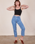 Alex is wearing P Cropped Cami in Basic Black worn with light wash Frontier Jeans