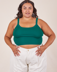Alicia is 5'9" and wearing XL Cropped Cami in Hunter Green paired with vintage tee off-white Western Pants
