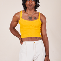 Jerrod is wearing Cropped Cami in Sunshine Yellow and vintage off-white Western Pants