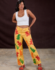 Kandia is wearing Gummy Bear Paintstamped Work Pants in Butter Yellow and Cropped Tank in Vintage Tee White