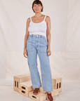 Tiara is wearing Carpenter Jeans in Light Wash and Cropped Cami in vintage tee off-white