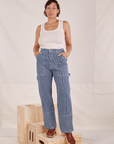 Tiara is 5'4" and wearing S Carpenter Jeans in Railroad Stripes paired with Tank Top in vintage tee off-white