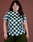 Ashley is 5'7" and wearing L Checker Organic Tee in Swamp Green