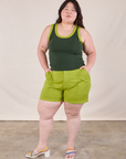 Ashley is wearing Colorblock Cropped Tank in Swamp Green and gross green Work Shorts