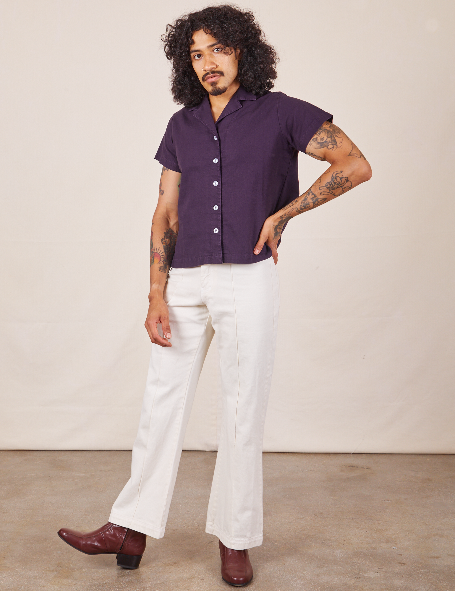 Jesse is wearing Pantry Button-Up in Nebula Purple and vintage tee off-white Western Pants