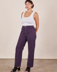Tiara is wearing Work Pants in Nebula Purple and Cropped Tank Top in vintage tee off-white