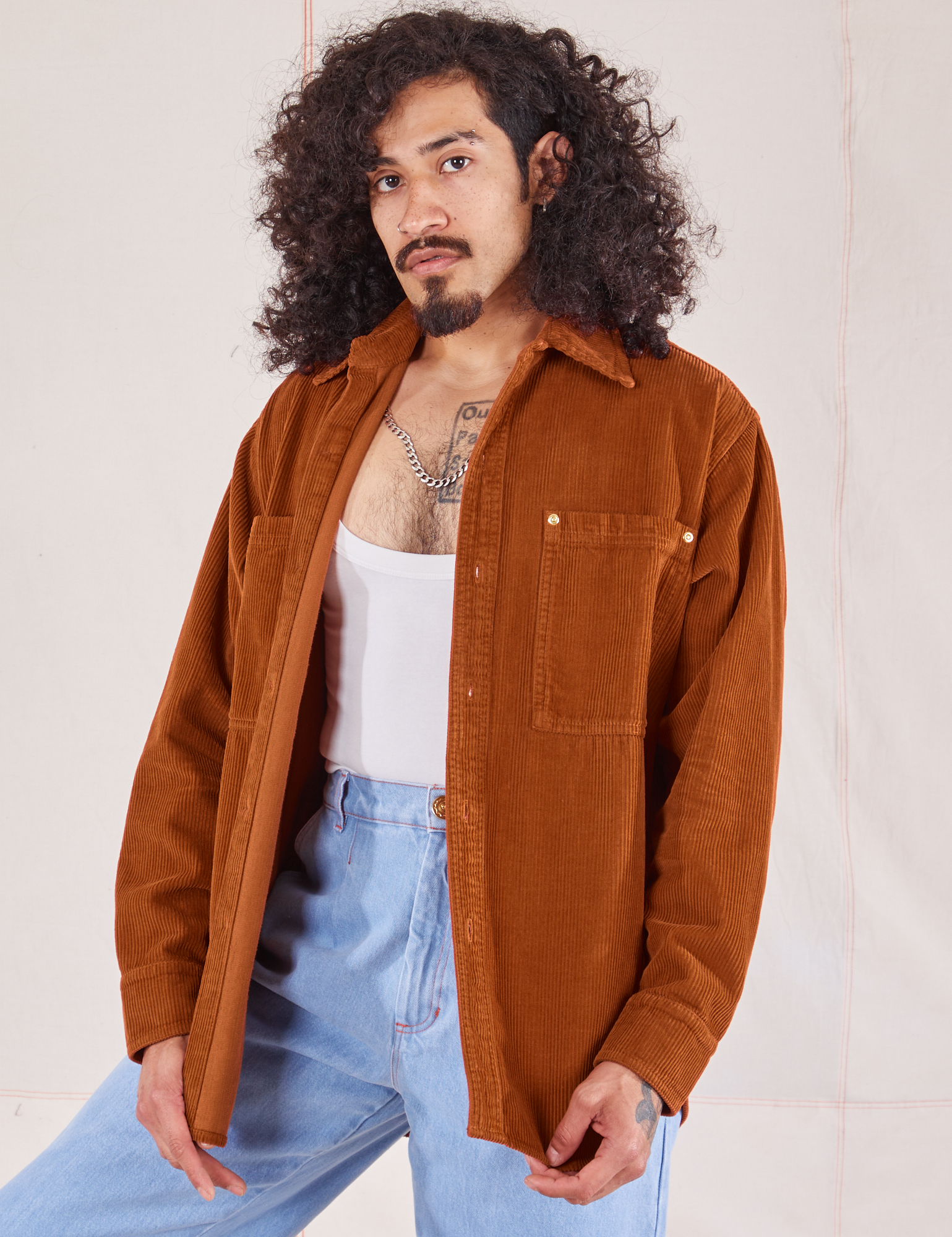 Jesse is 5&#39;8&quot; and wearing XS Corduroy Overshirt in Burnt Terracotta paired with vintage off-white Cropped Tank and light wash Trouser Jeans