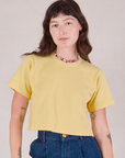 Alex is wearing Cropped Burly Tee in Butter Yellow