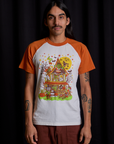 Anthony is 5'6" and wearing S Short Sleeve Raglan Tee in Haunted House