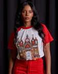Kandia is 5'3" and wearing XXS Short Sleeve Raglan Tee in Gates of Hell