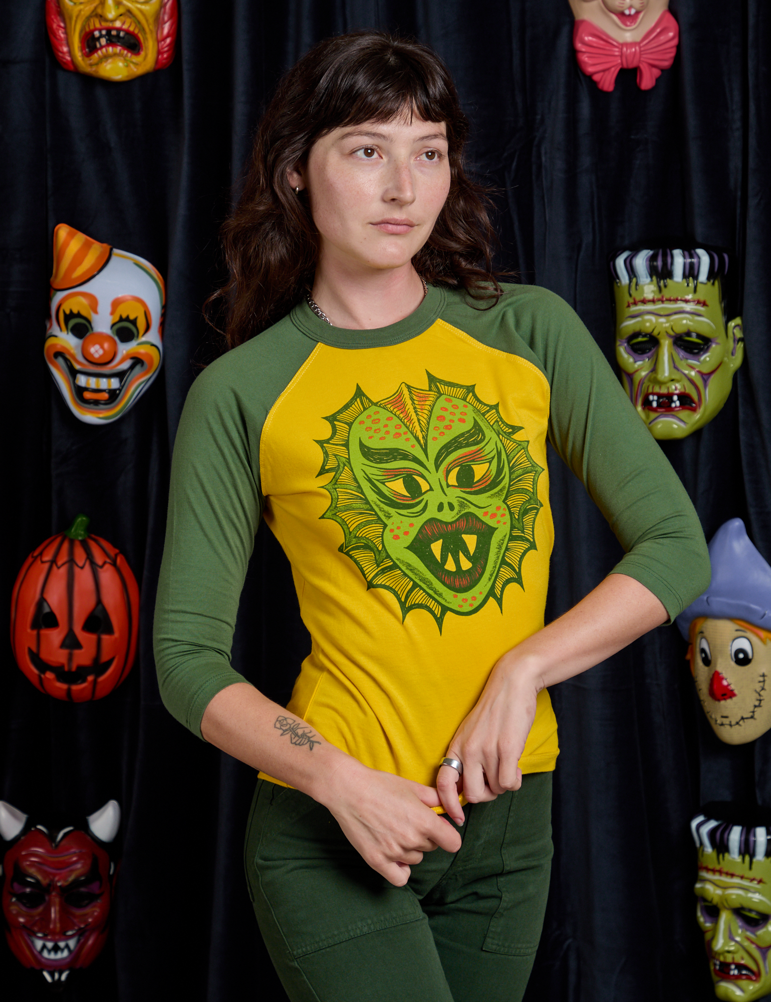 Alex is 5'8" and wearing P Raglan Tee in Creature