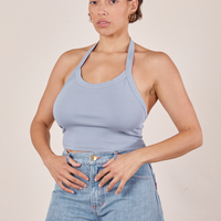 Tiara is wearing Halter Top in Periwinkle and light wash Sailor Jeans