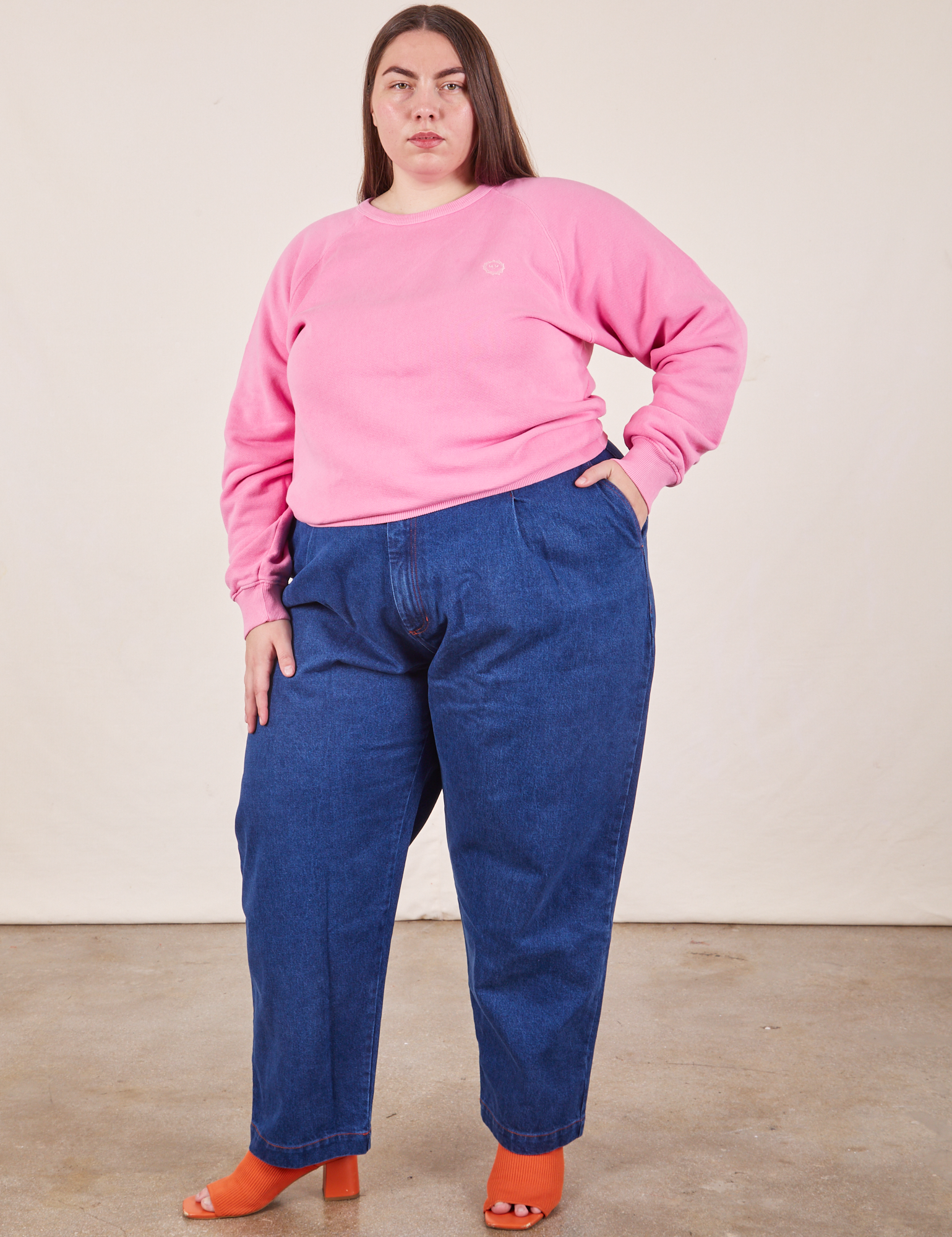 Marielena is wearing Heavyweight Crew in Bubblegum Pink paired with dark wash Denim Trouser Jeans